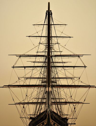 Rigging on a tall ship at sunrise