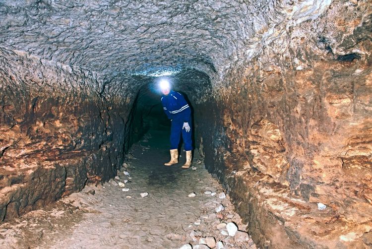 The old sandstone water tunnel.  sandstone tunnel moistened walls. dry channel carved in underground
