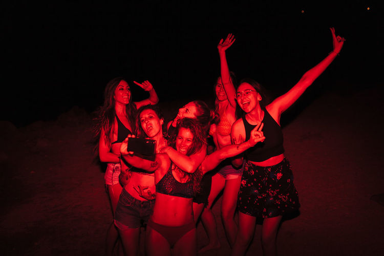 Group of women taking selfie at beach