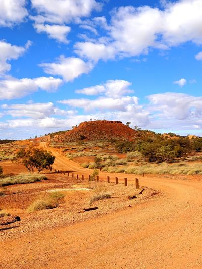 Scenic view of arid landscape against sky