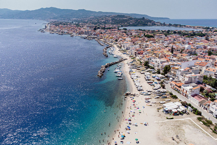Top view of the beautiful beach of punta faro in sicily. messina, italy.