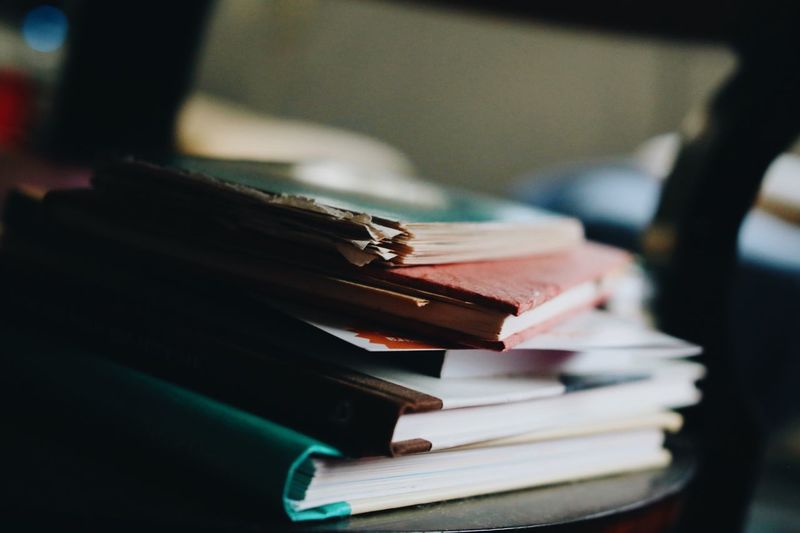 STACK OF BOOKS ON SHELF