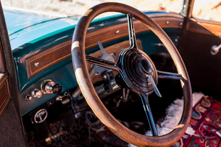 High angle view of rusty steering wheel in vintage car