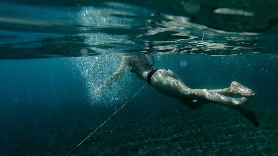 Full length of woman swimming in sea