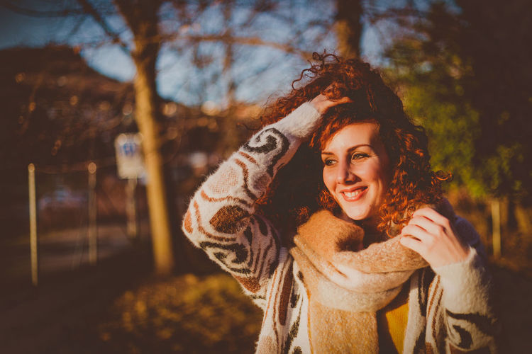 Portrait of smiling young woman outdoors