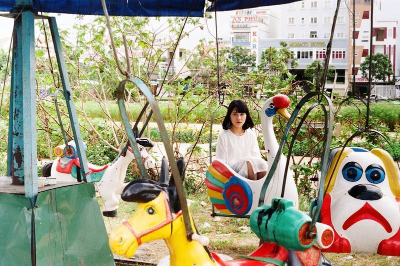 Young woman in retro amusement park
