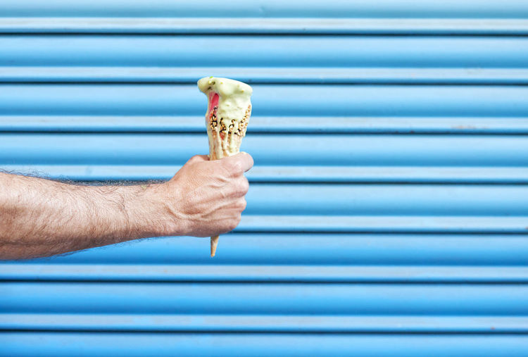 Human hand holding ice cream