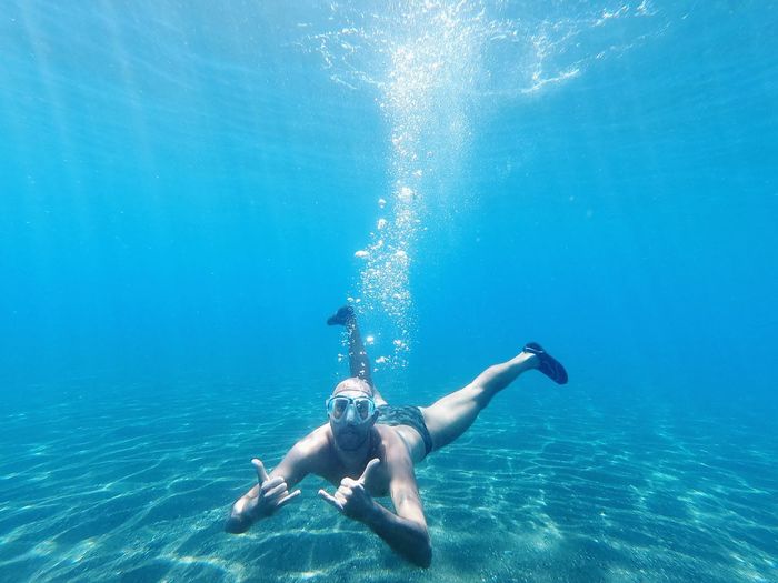 Full length of man swimming in sea