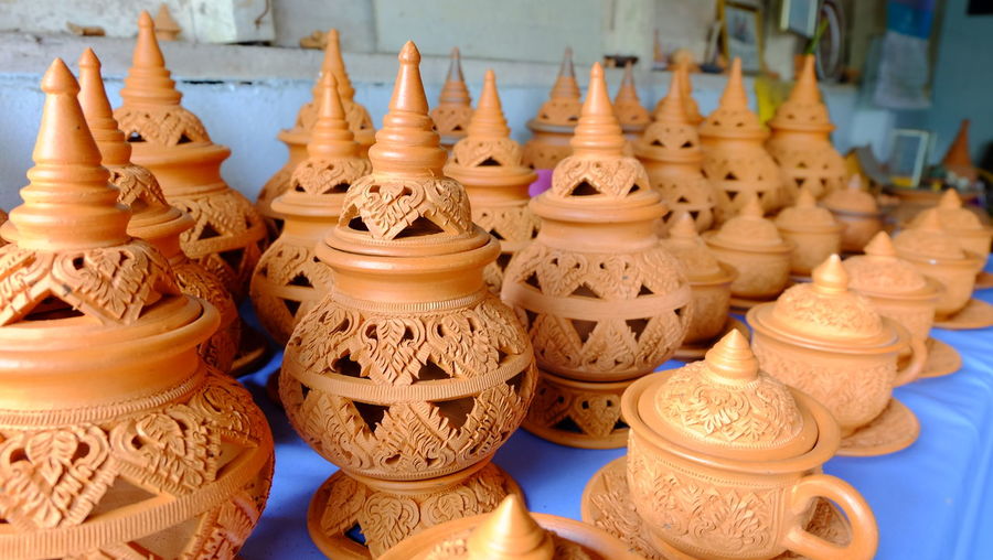 Close-up of various pots at market stall