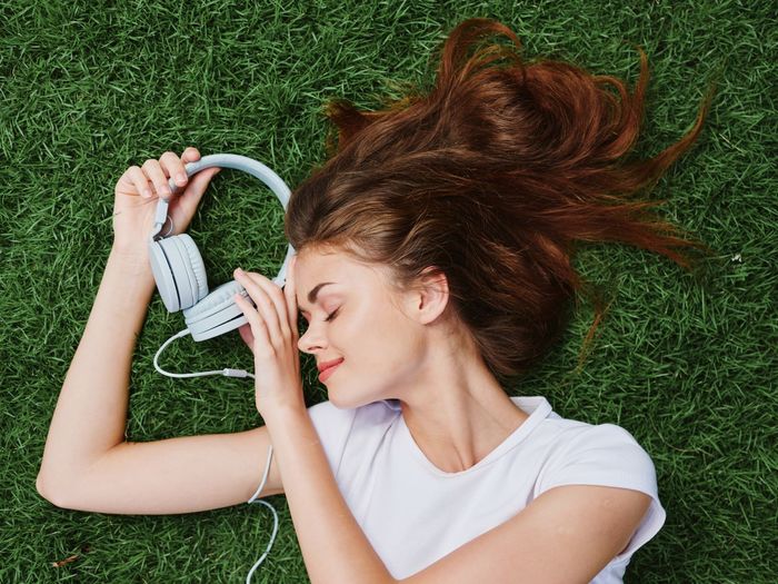 Side view of young woman using mobile phone