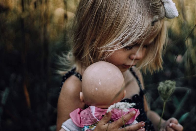 Close-up of girl holding doll