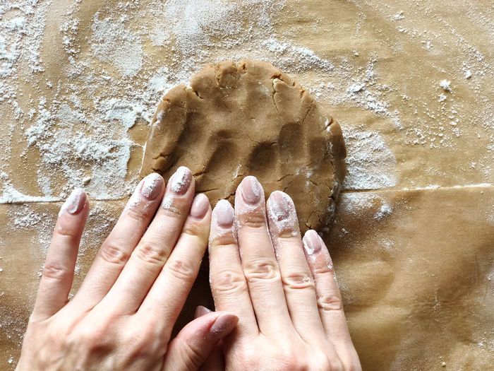 Cropped image of hands making cookie