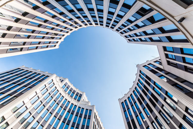 Low angle view of modern buildings against clear sky