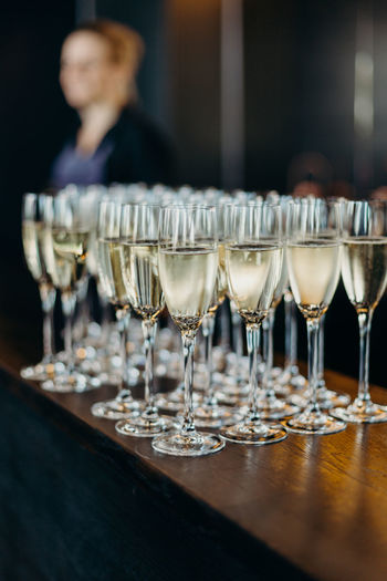 Close-up of champagne flutes on wooden table