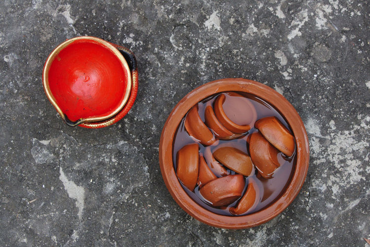 High angle view of  earthen lamps immersed in water in preparation for traditional celebration.
