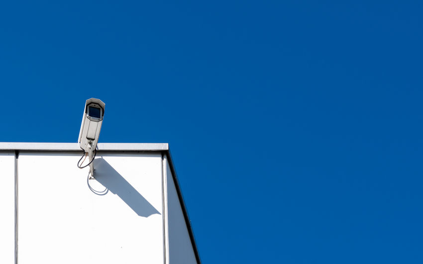 Low angle view of lamp against clear blue sky