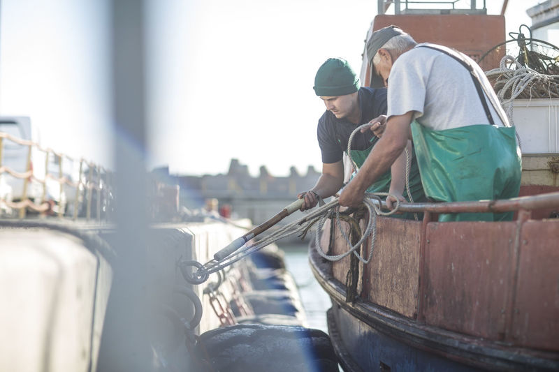 Fishermen working on trawler