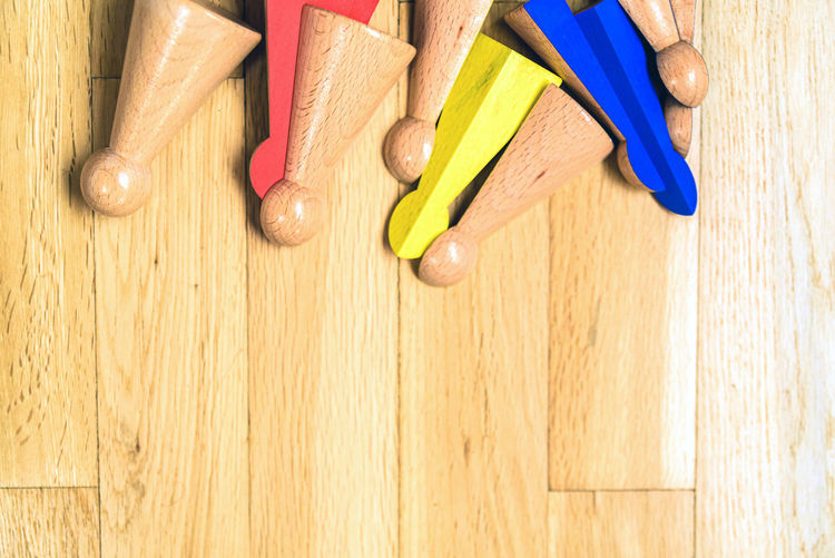 High angle view of colored pencils on wooden table