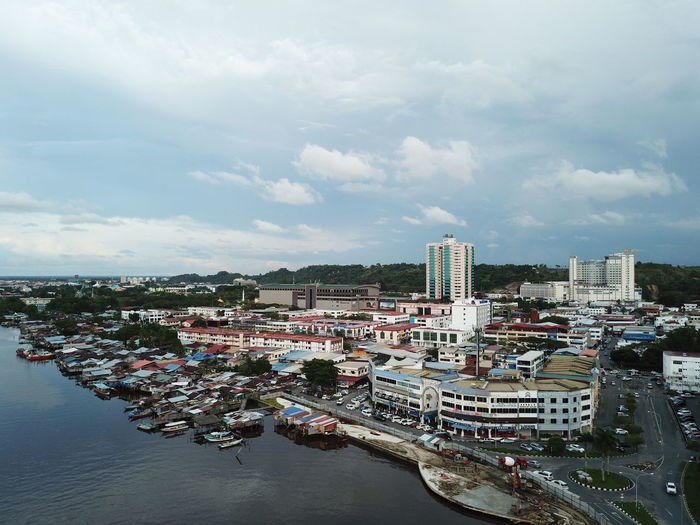 High angle view of harbor by buildings in city