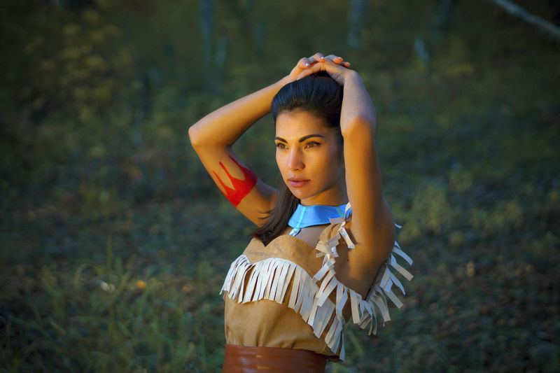 Young woman in traditional clothing looking away