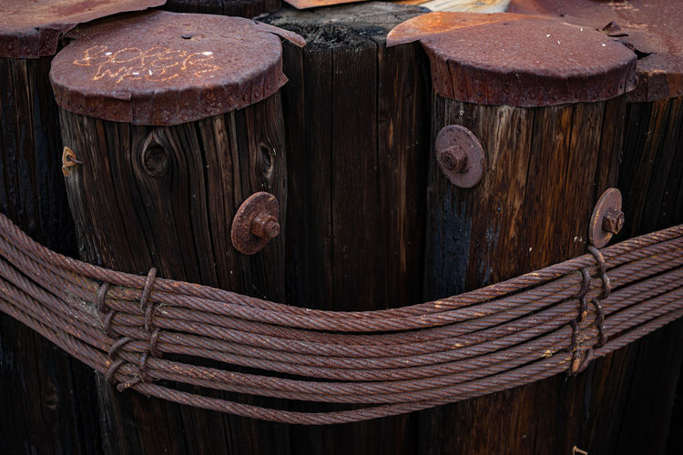 Close-up of rope tied on wooden door