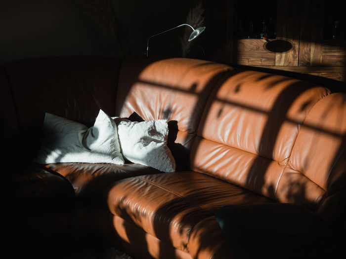 Sun and shadow on sofa indoors