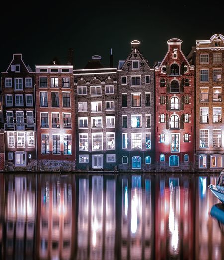ILLUMINATED BUILDINGS AT NIGHT