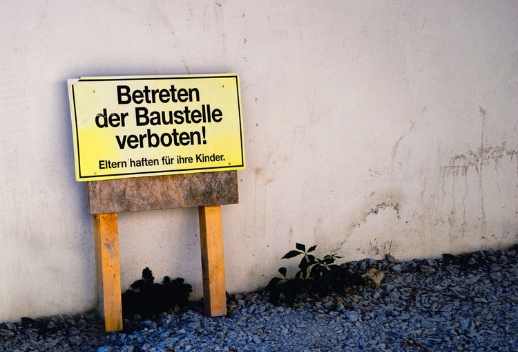 Information sign by wall