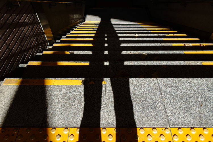High angle view of yellow shadow on floor