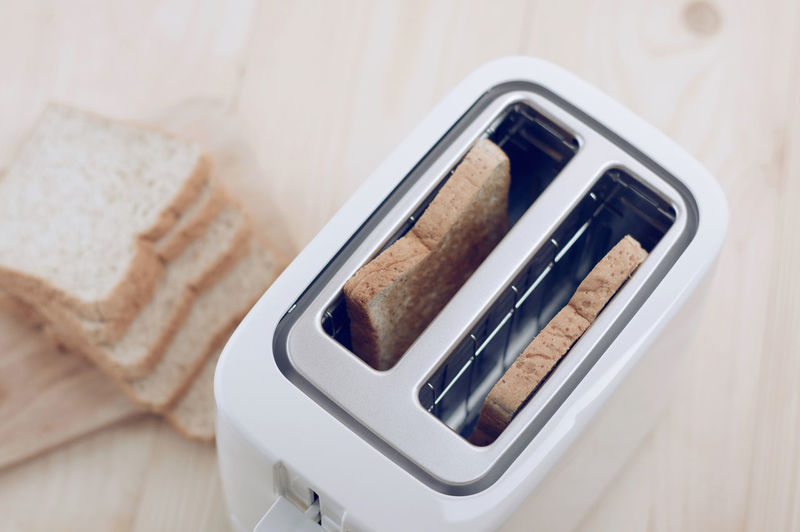 High angle view of breads in toaster