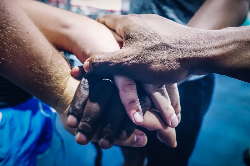 Close-up of man touching woman hand