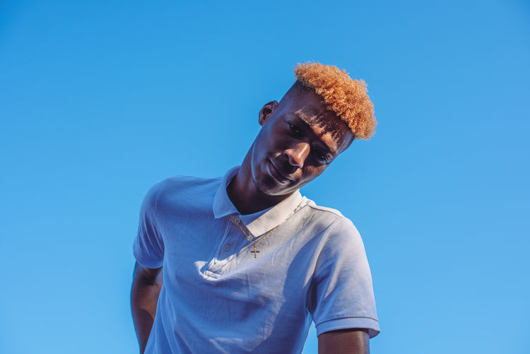 Portrait of handsome young man with orange colored hair