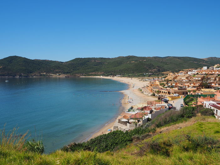 High angle view of sea against clear blue sky