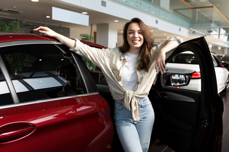 Portrait of young woman in car