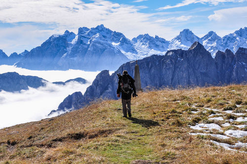 Rear view of man hiking european alps