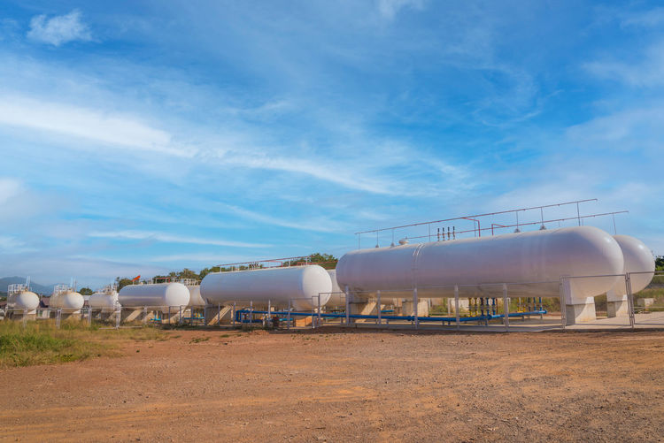 Natural gas storage tanks in industrial plant.