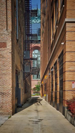 Narrow alley amidst buildings in city