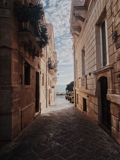 Photo taked in siracusa, where you can see those beutiful buildings next the mediterranean sea.