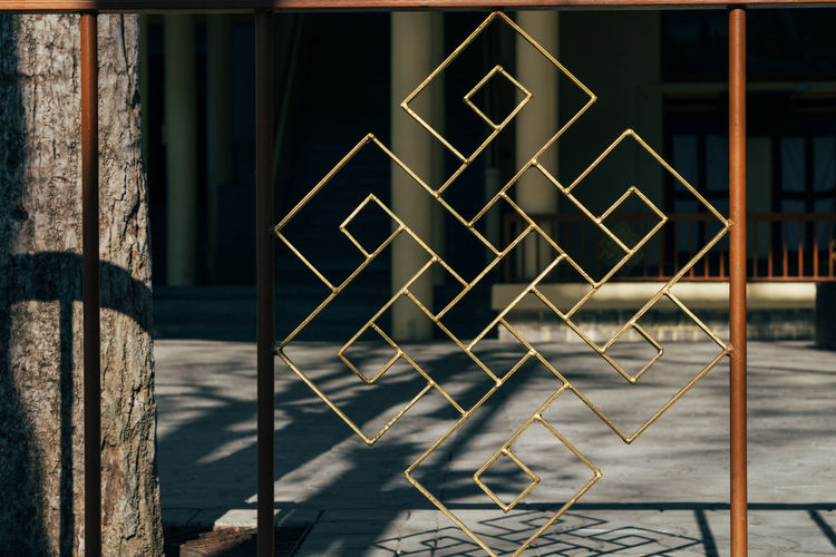 Metal railing against building in city