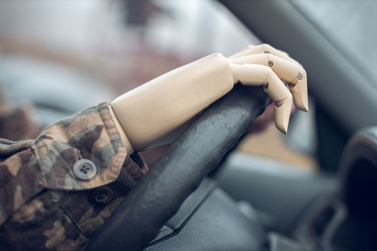Soldier with artificial hand driving car