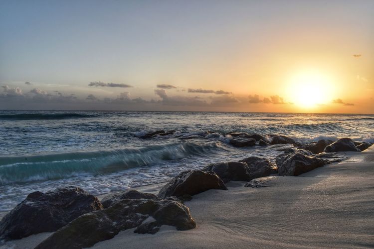 Scenic view of sea against sky during sunset