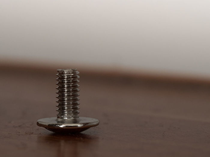 Close-up of bolt on table