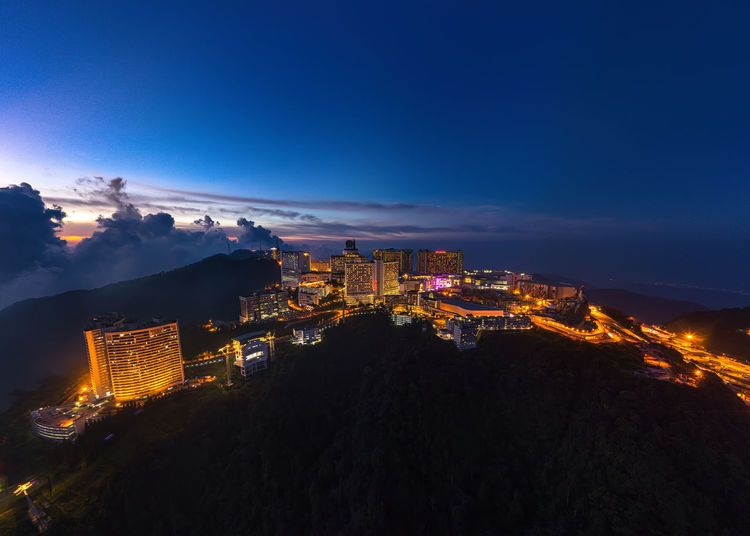 High angle view of illuminated buildings in city at night