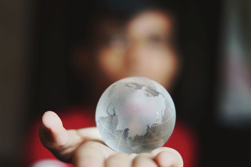 Woman holding crystal globe