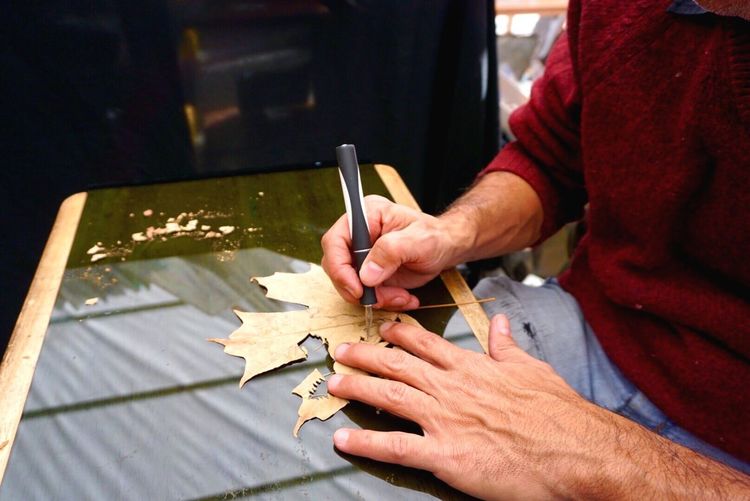 Male hands making decoration