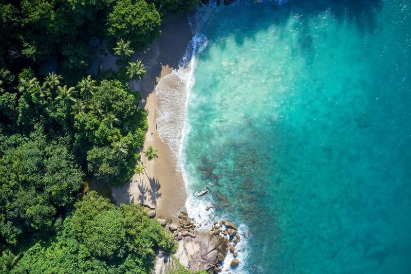 Drone field of view of secret cove and coastline mahe, seychelles.