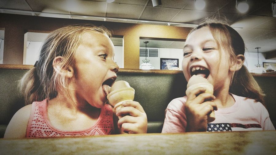 Portrait of girls eating ice cream