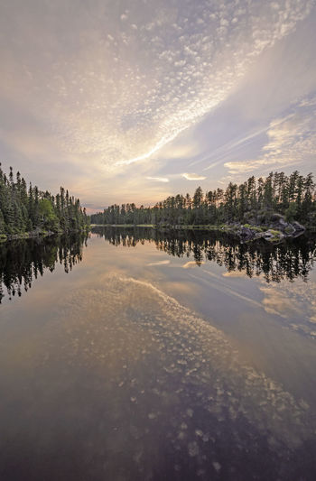 Twilight reflections in the north woods on snipe lake in the boundary waters in minnesota