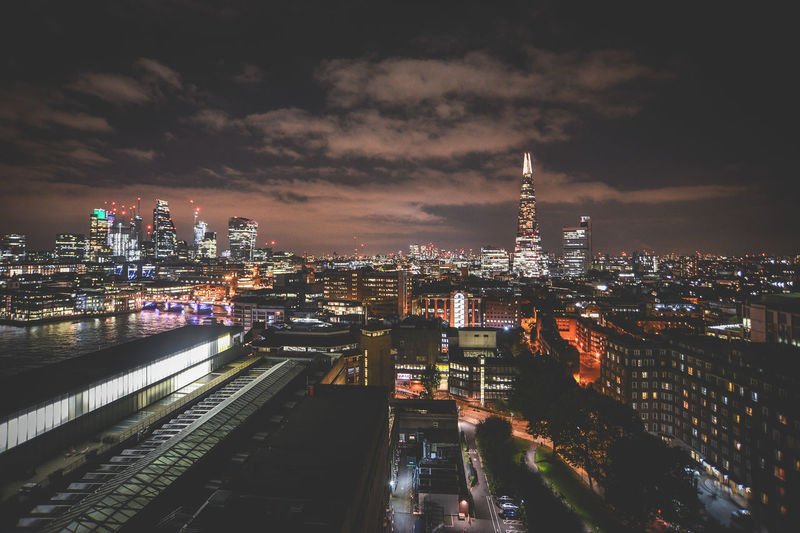 High angle view of illuminated city buildings at night