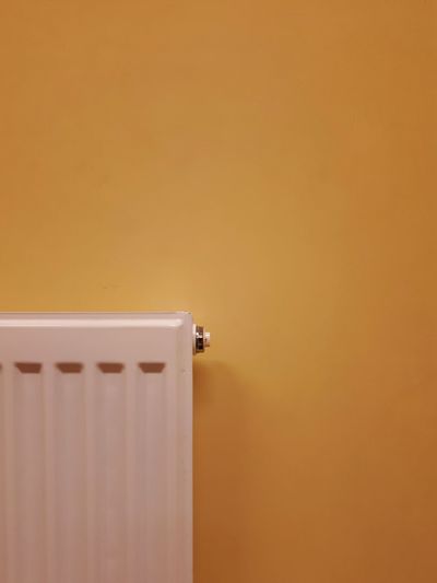  radiator against yellow wall